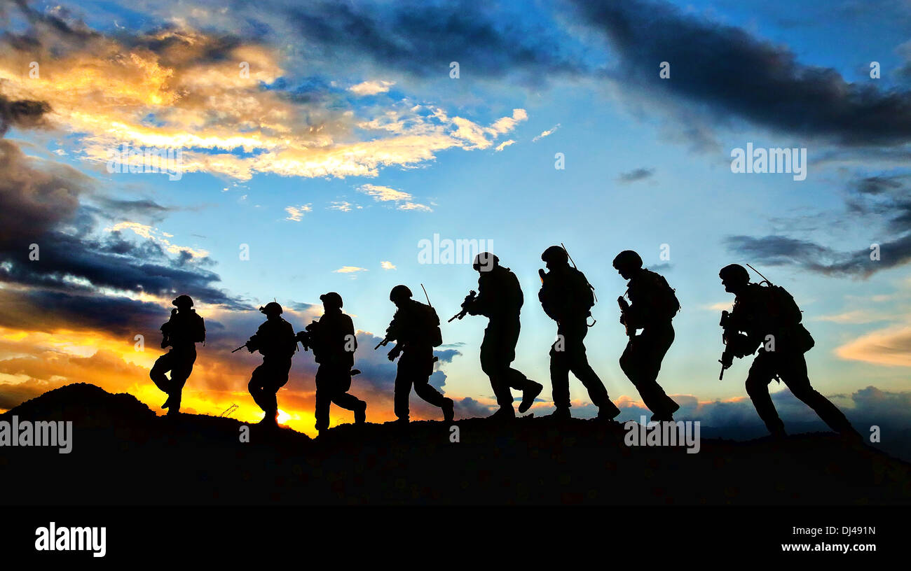 Australian army soldiers with the The Royal Australian Regiment patrol at sunrise November 6, 2013 at Multinational Base Tirin Kot, Uruzgan province, Afghanistan. Stock Photo