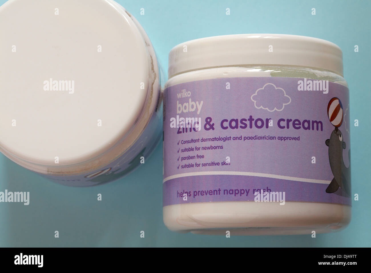 tubs of Wilko baby zinc and castor cream set on pale blue background Stock Photo