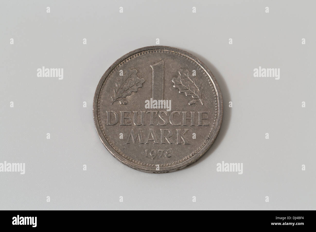 A close up photograph of one Deutsche Mark (Deutschmark; German Mark). A single coin isolated on white background. Stock Photo
