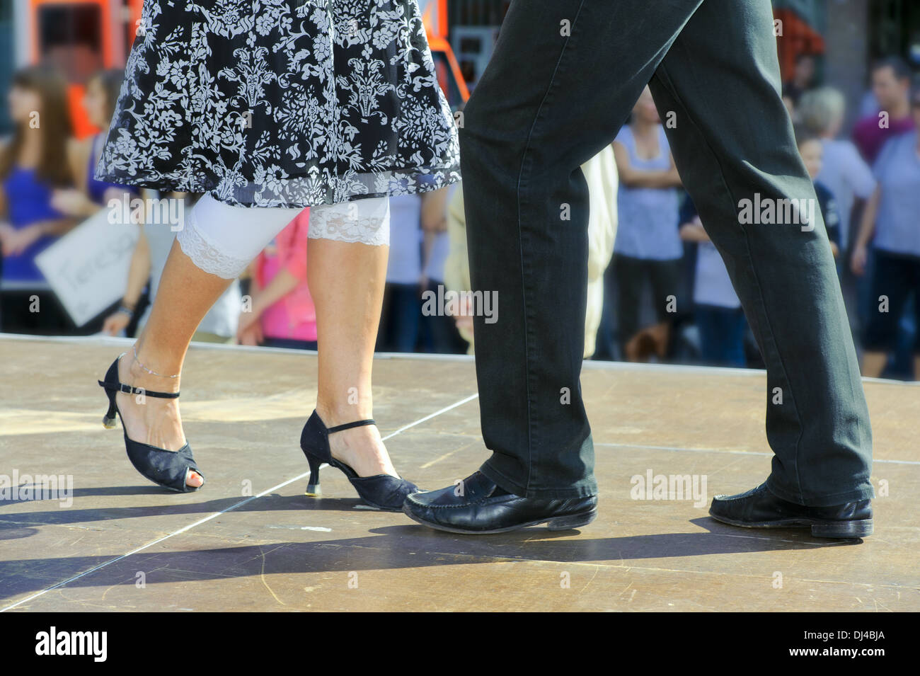 Couple dancing on a street stage Stock Photo