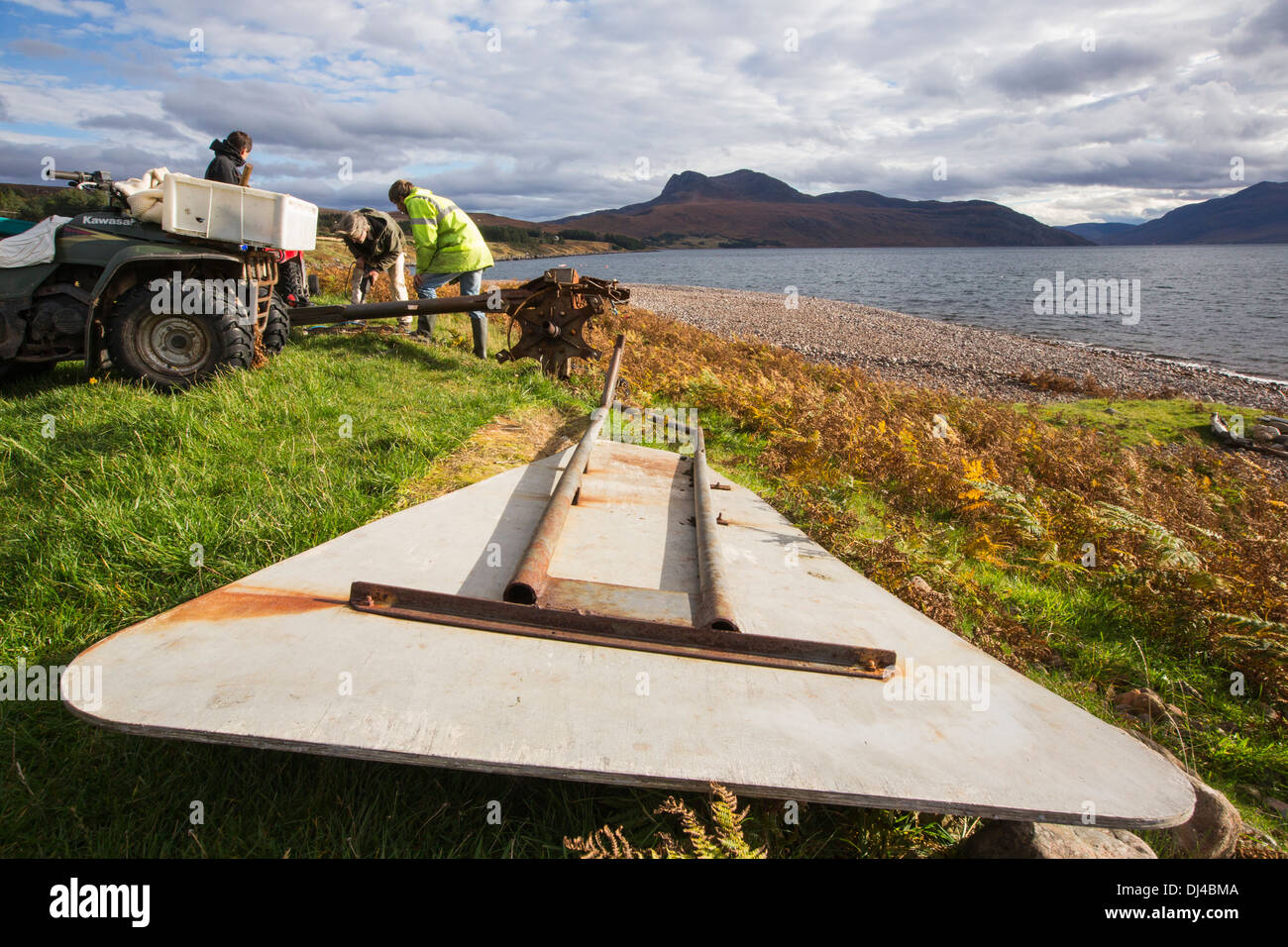 Hugh Piggott doing maintenance on his home made wind turbines in Scoraig, in NW Scotland, a remote off grid, communitiy, UK Stock Photo