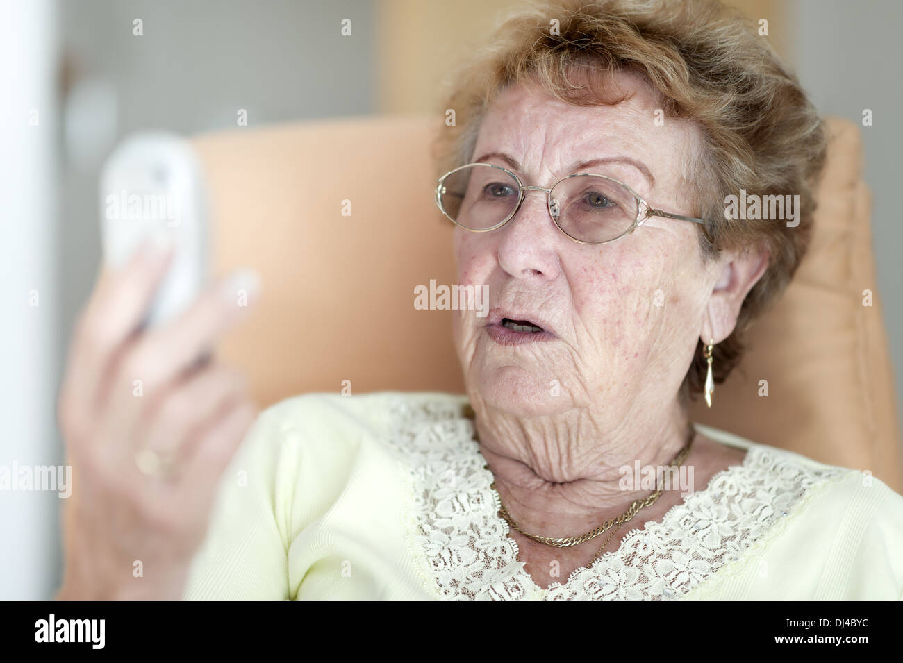 Elderly woman with phone Stock Photo