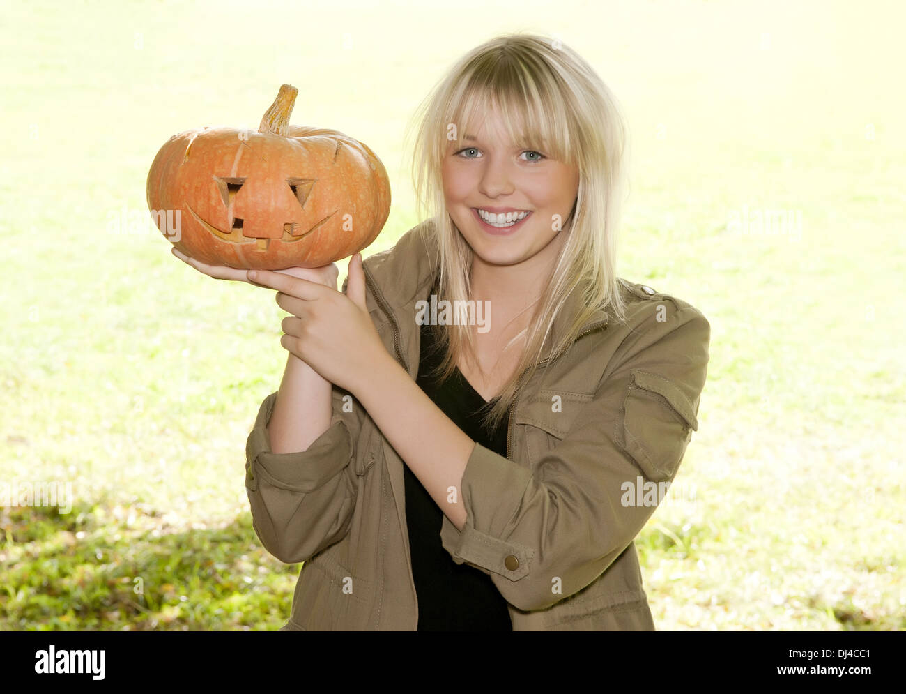young woman with halloween-pumpkin Stock Photo