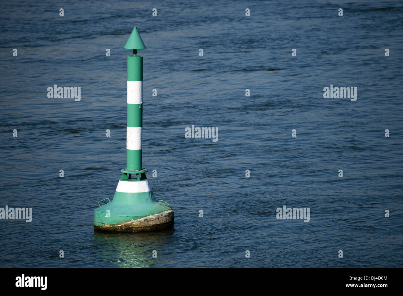 Buoy in green and white Stock Photo