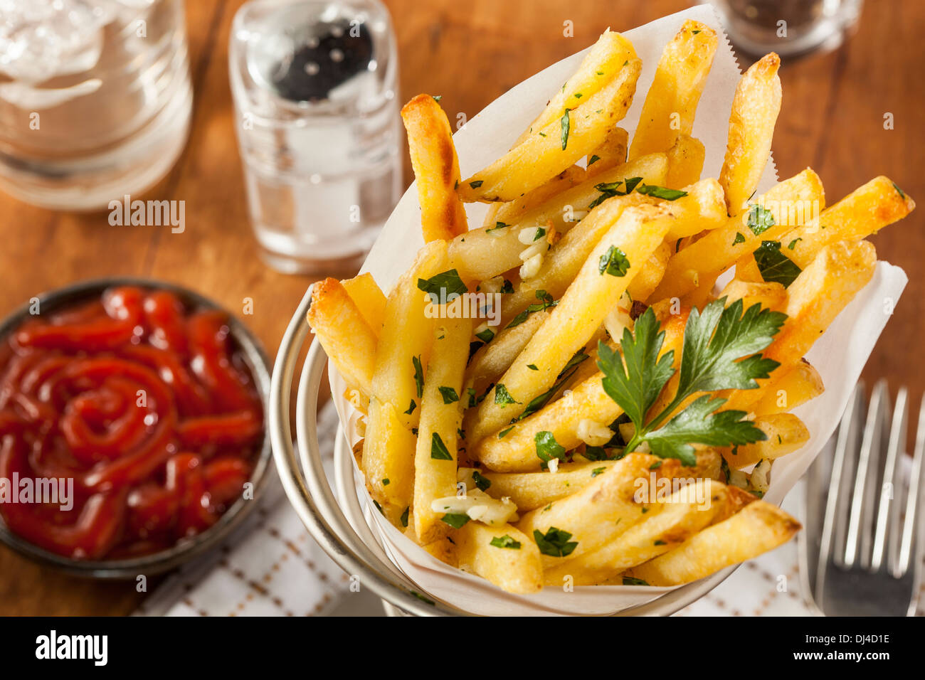 Garlic and Parsley French Fries with Ketchup Stock Photo