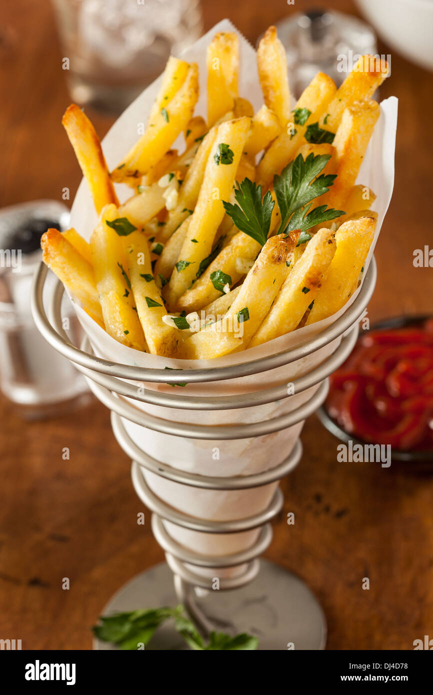 Garlic and Parsley French Fries with Ketchup Stock Photo