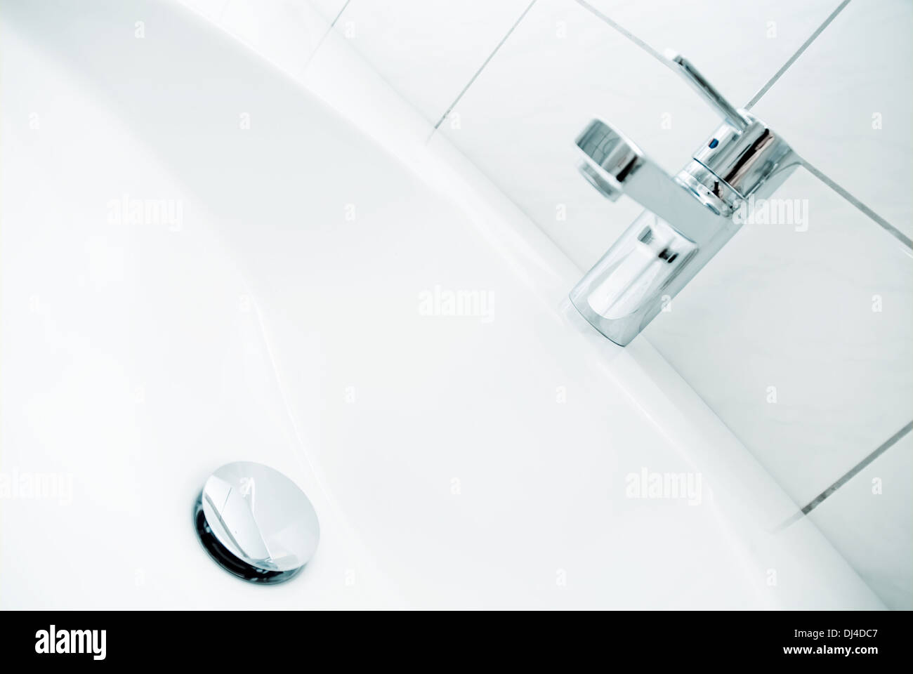Sink with faucet and drain Stock Photo