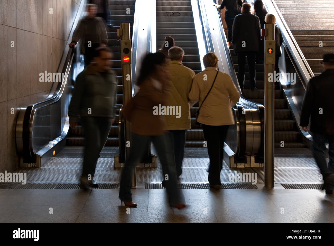 People on an escalator Stock Photo