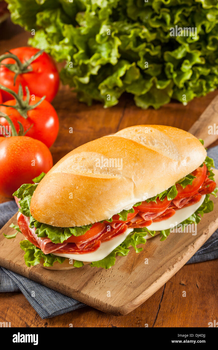 Homemade Italian Sub Sandwich with Salami, Tomato, and Lettuce Stock