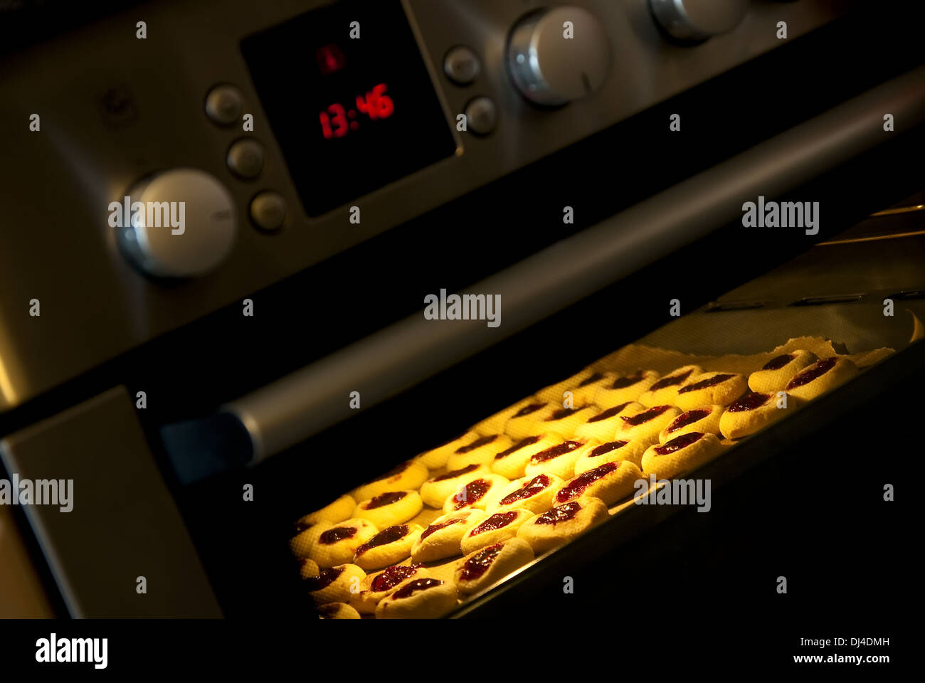 Cookies in the oven Stock Photo Alamy