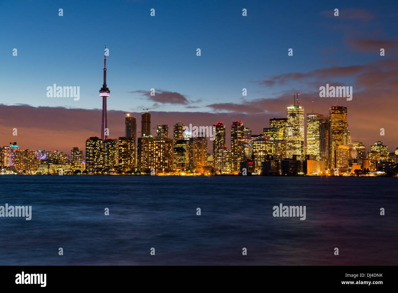 Toronto skyline across Lake Ontario, Canada at night / dusk Stock Photo