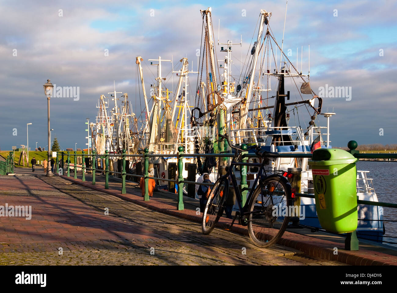 Pier occupied in the fishing port Greetsiel Stock Photo