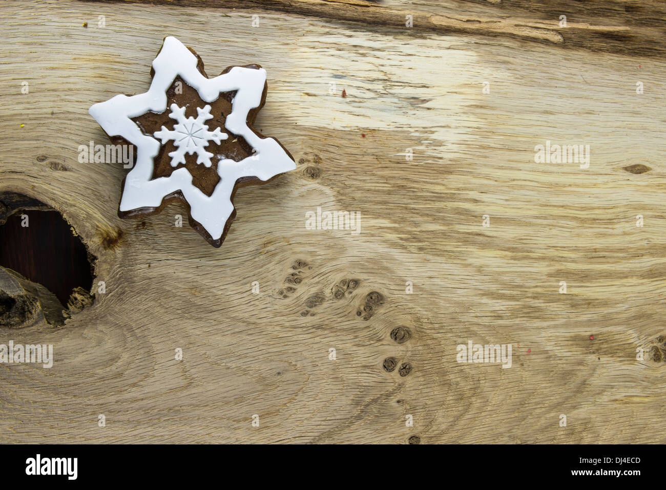 Traditional snowflake shaped Christmas gingerbread cookie Stock Photo