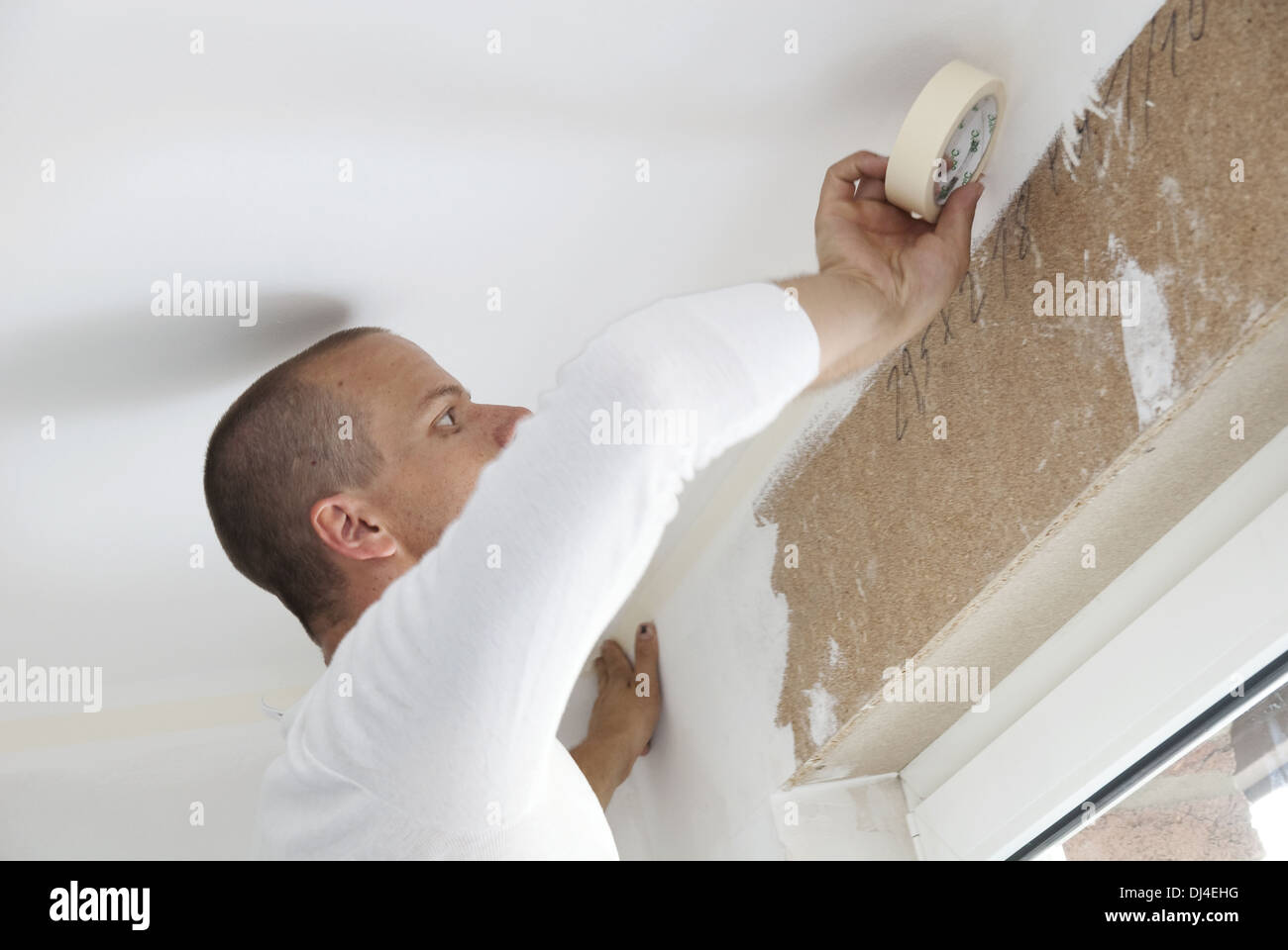 Painter stuck from wall Stock Photo