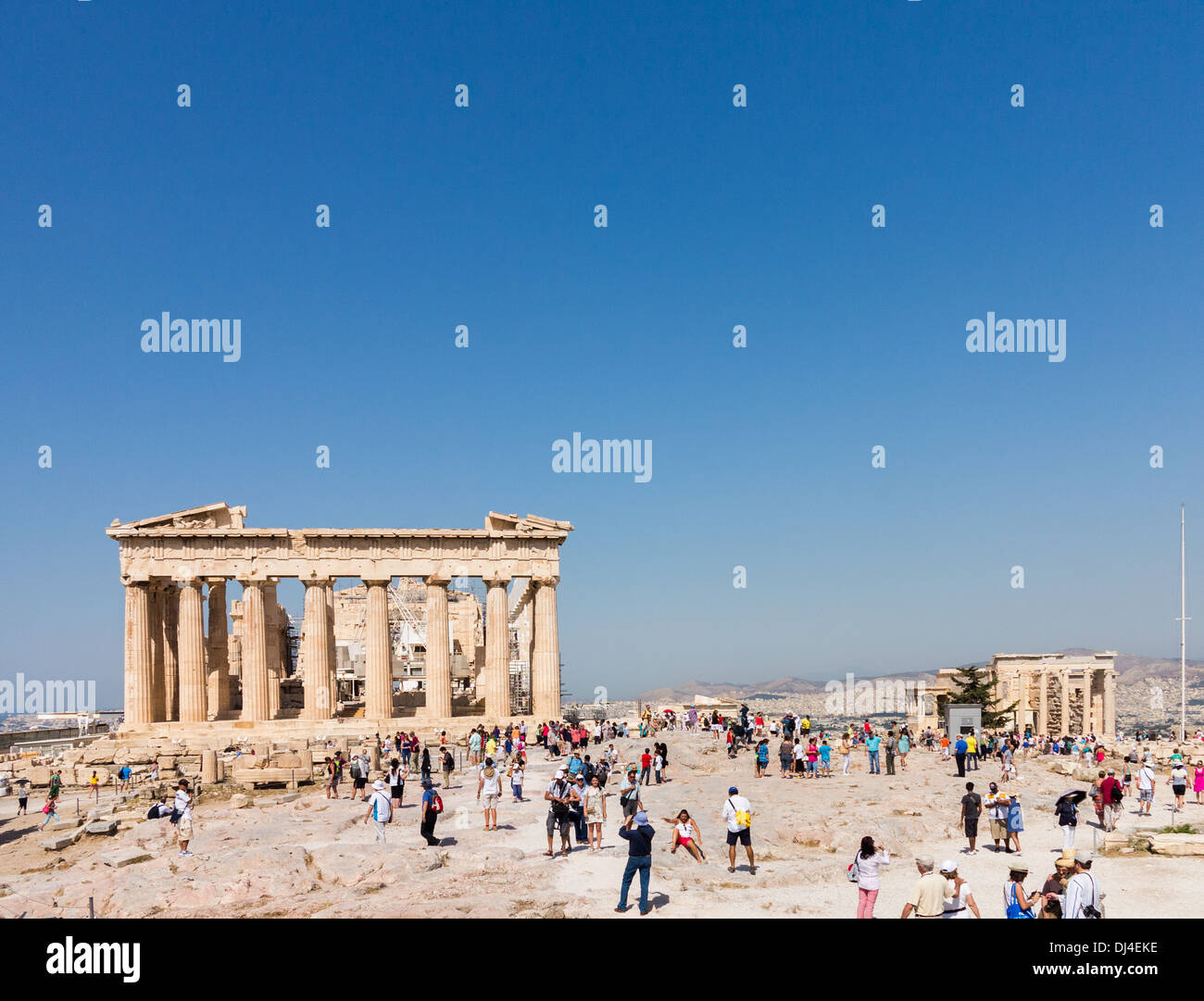 Acropolis, Athens, Greece - with crowds of tourists visiting the Ancient Greece site Parthenon and The Erechtheion Stock Photo