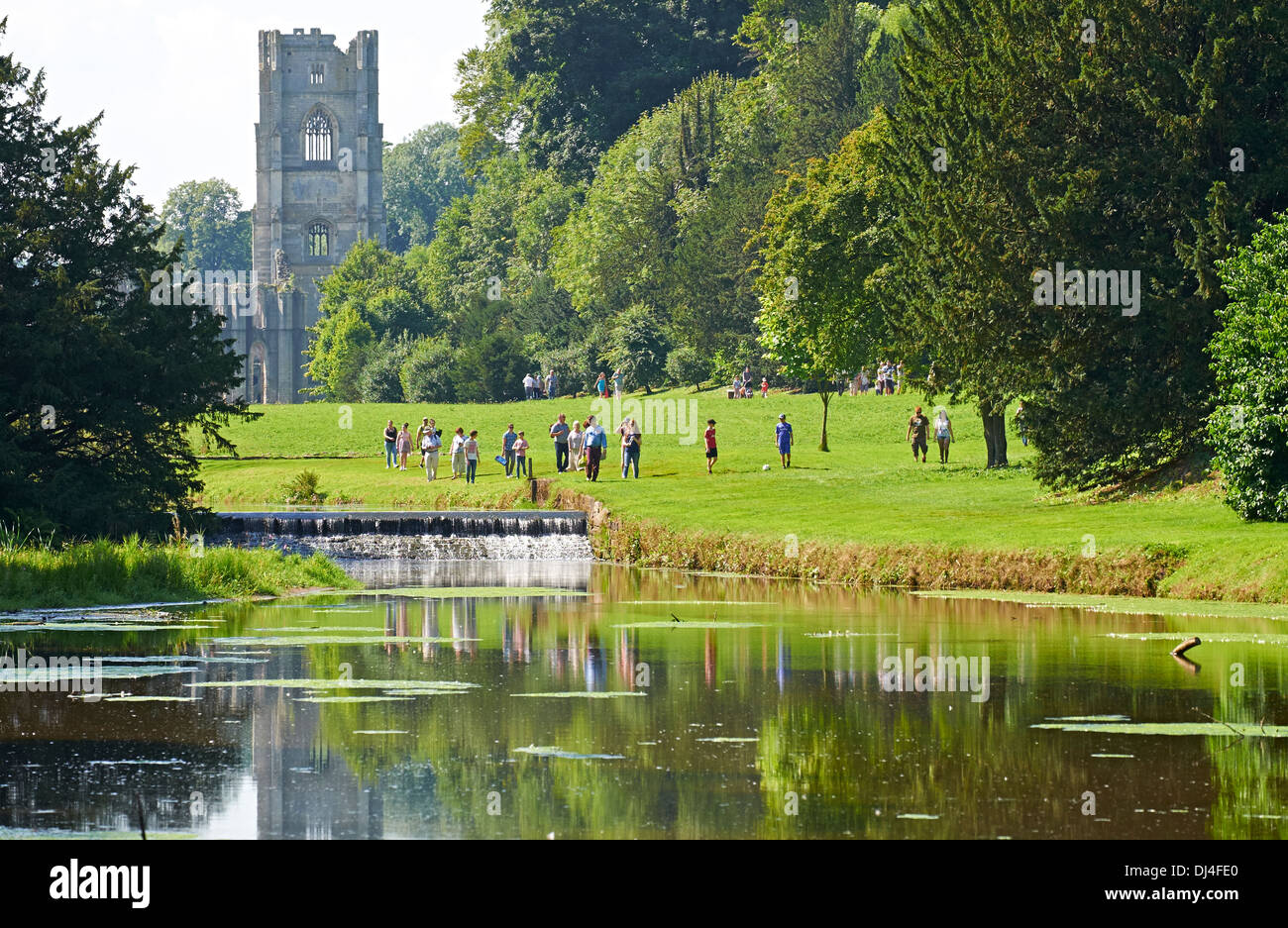 Exterior views of Fountains Abbey reflected in the river. North Yorkshire England. Stock Photo