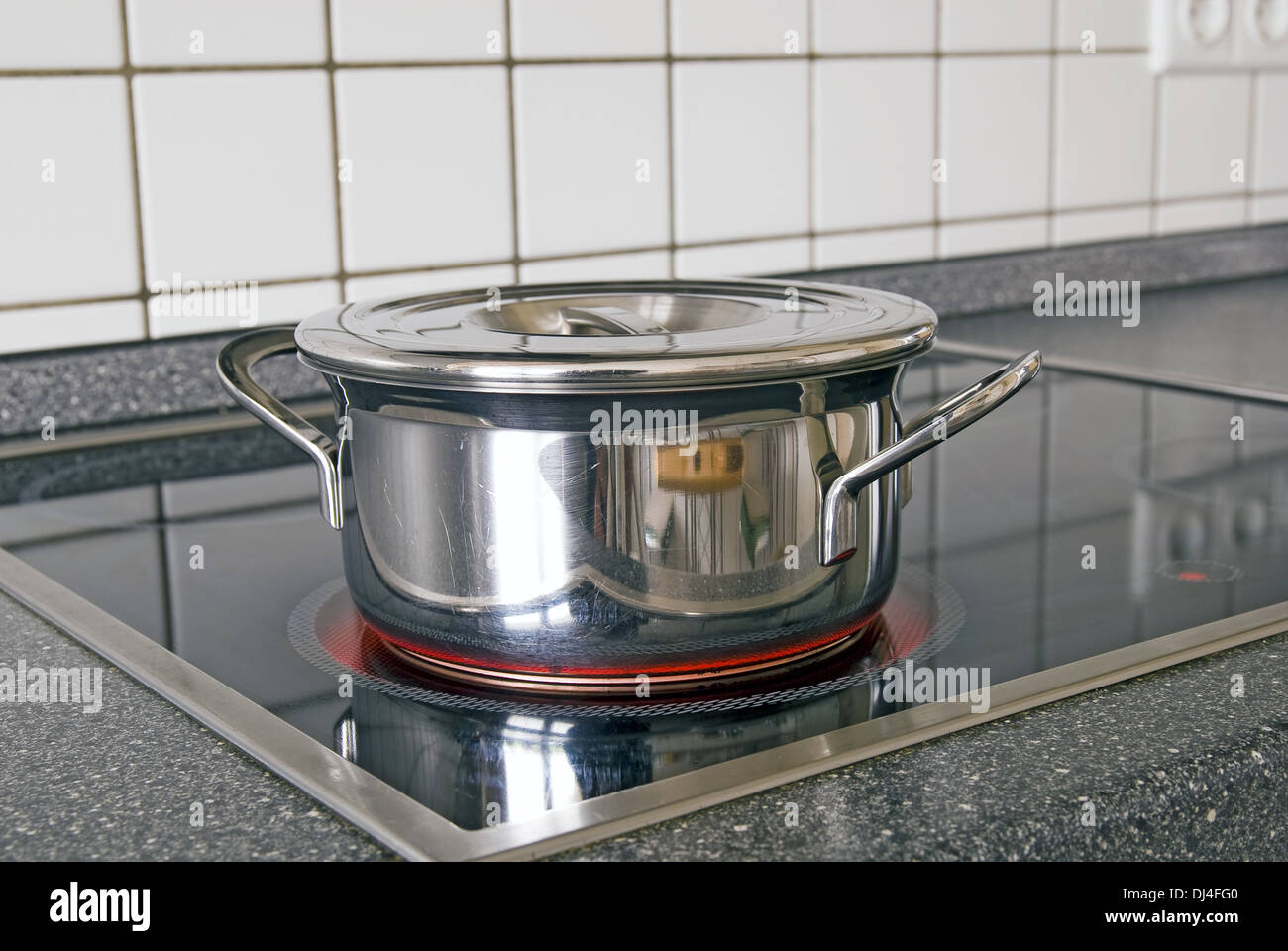 Cooking pot on stove Stock Photo