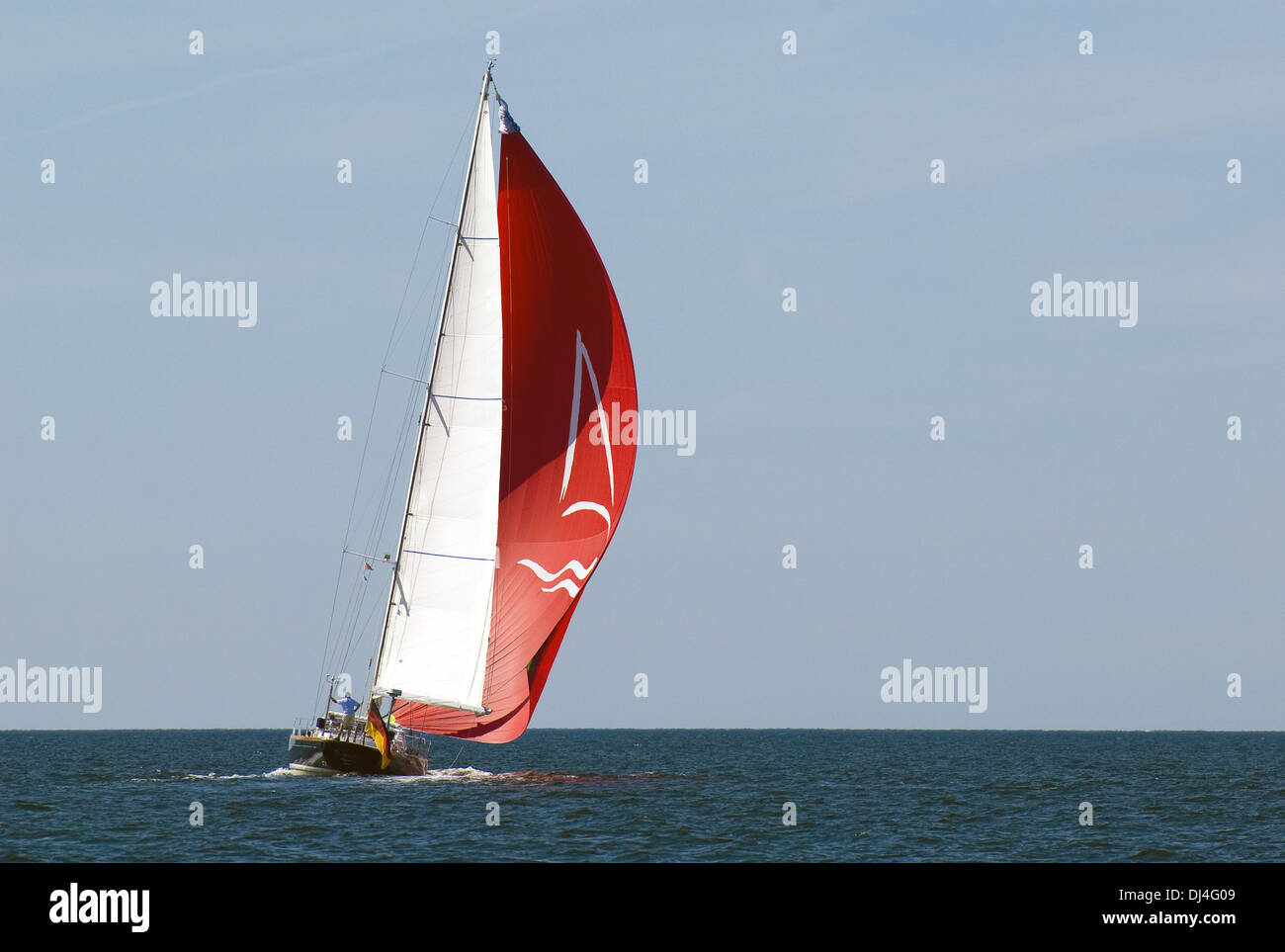 Sailing yacht with red Fock Stock Photo