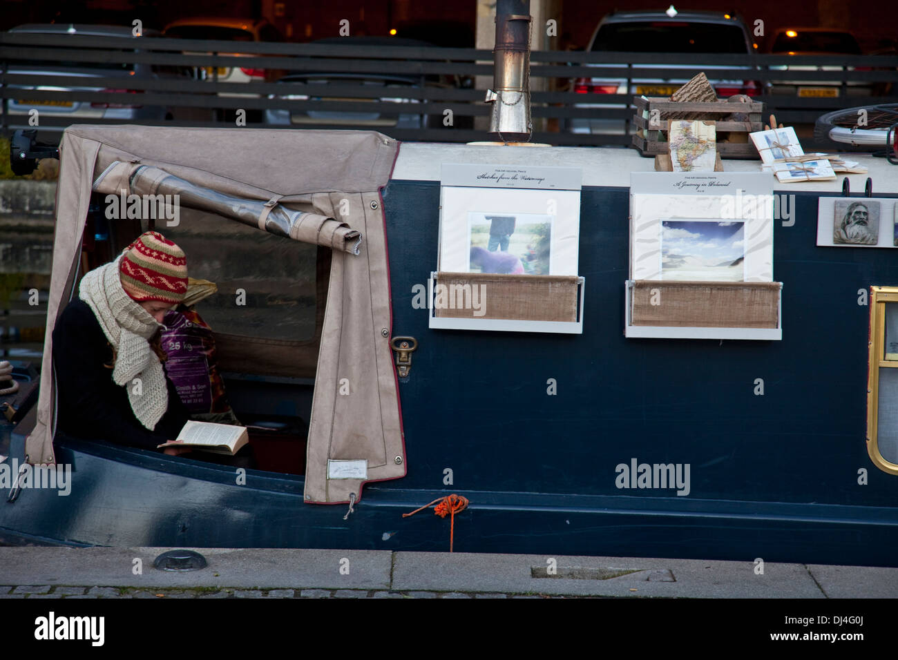 Woman Reading A Book, Traditional Narrow Boat, 'Little Venice' London, England Stock Photo