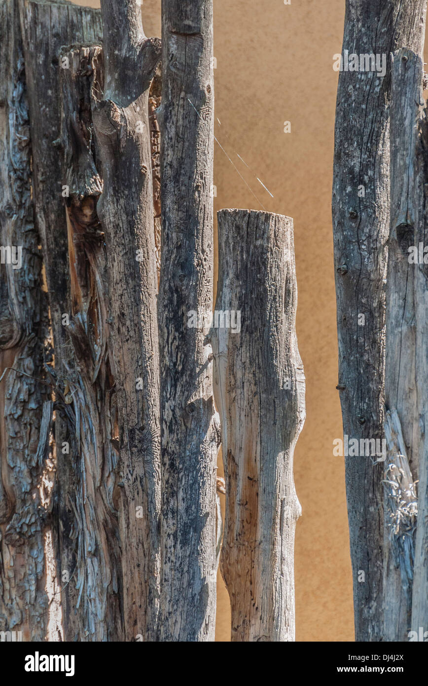 A close-up view of a traditional fence made of tree branches as is common in the state of New Mexico, USA. Stock Photo