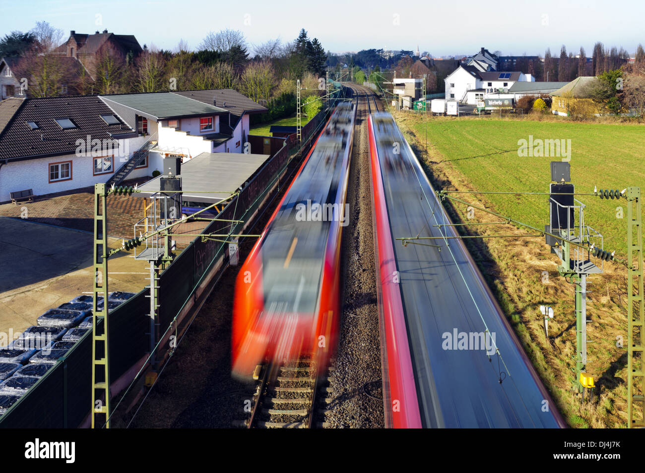 Two passenger trains meet on the open road Stock Photo