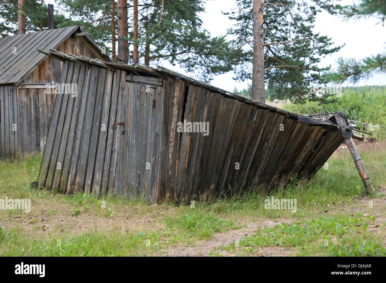Old rickety barn in northen village, Russia Stock Photo