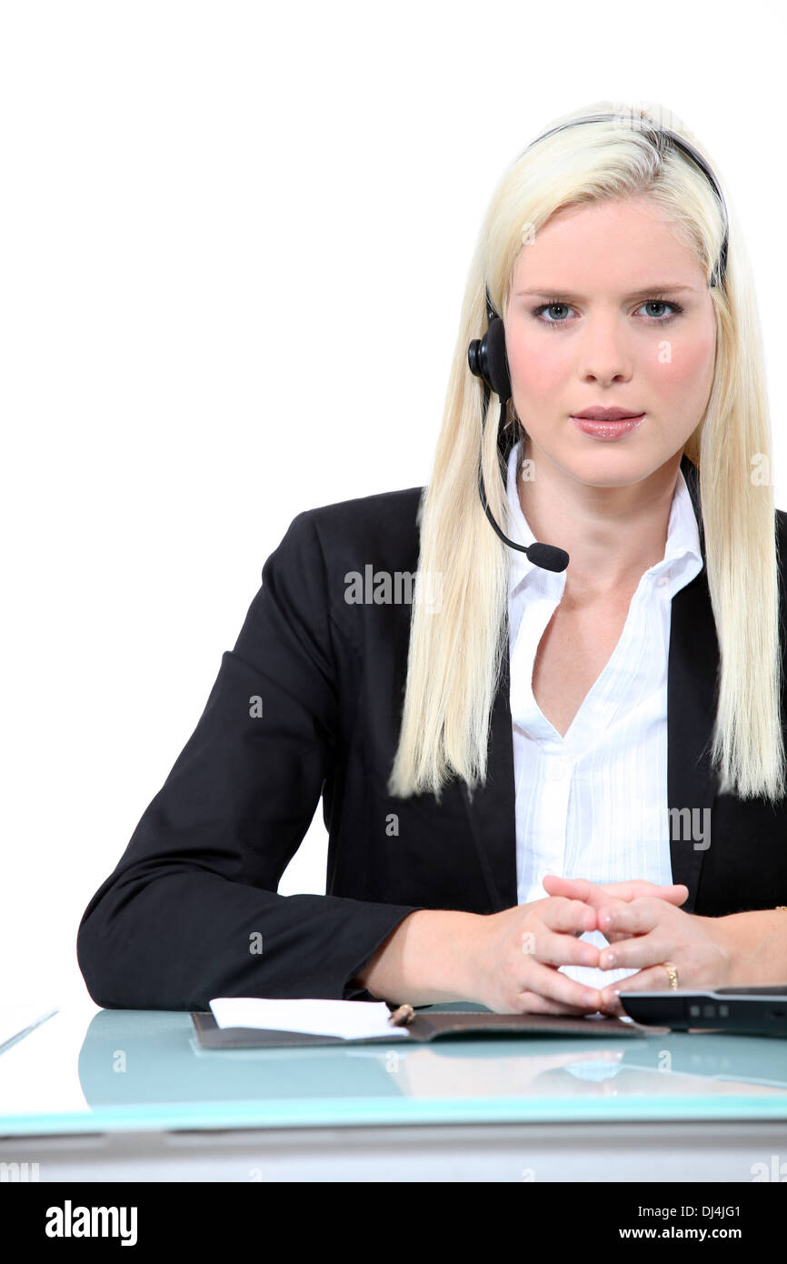 Woman wearing a telephone headset Stock Photo Alamy