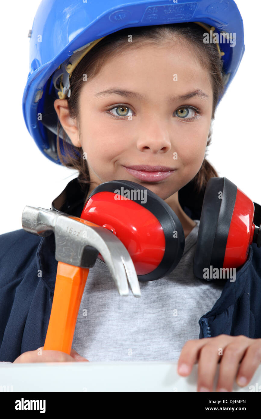Child with a hammer, hardhat and ear defenders Stock Photo Alamy