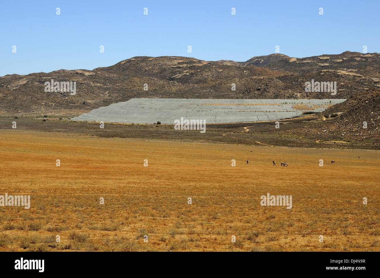 Dam of the stockpile of a closed coppermine Stock Photo