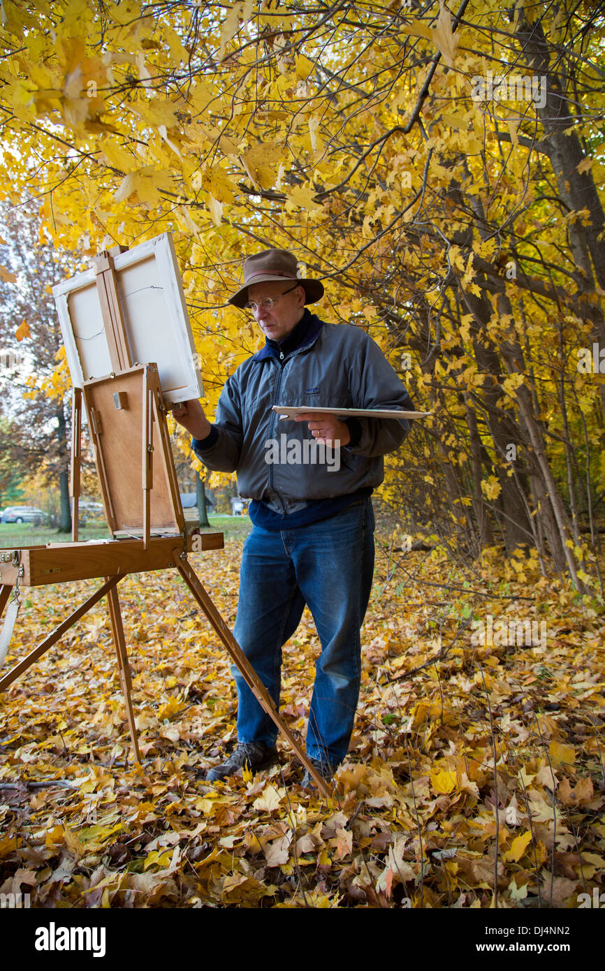 Porter, Indiana - An artist paints fall colors at Indiana Dunes National Lakeshore. Stock Photo