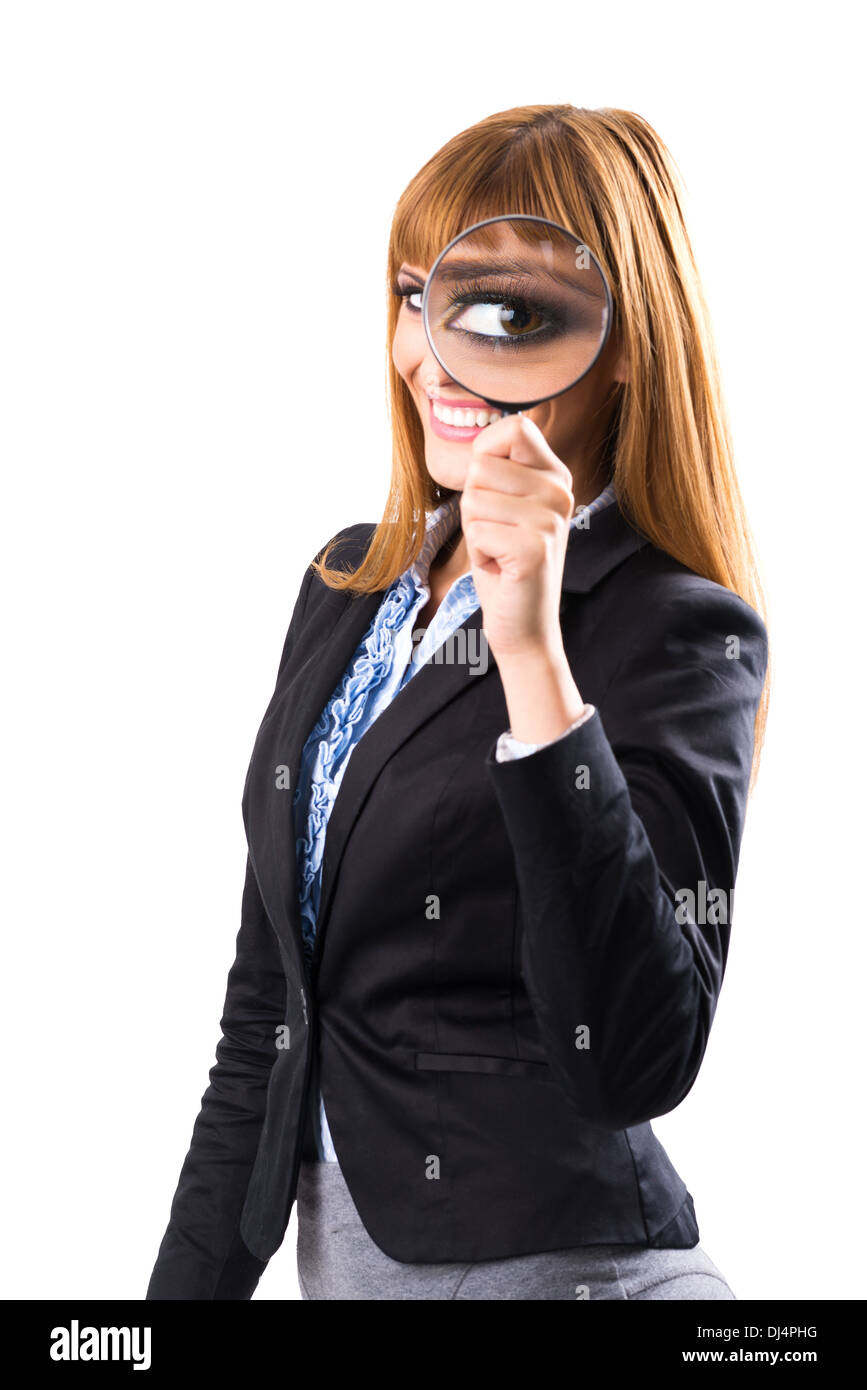 Businesswoman looking through magnifying glass Stock Photo - Alamy