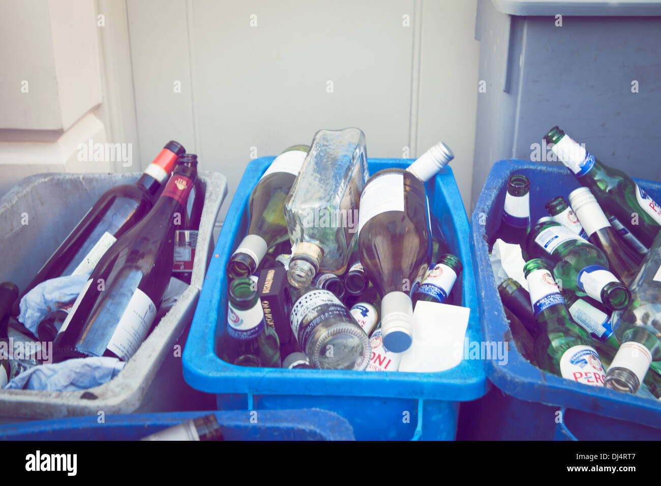Glass bottles in recycling bins Stock Photo Alamy