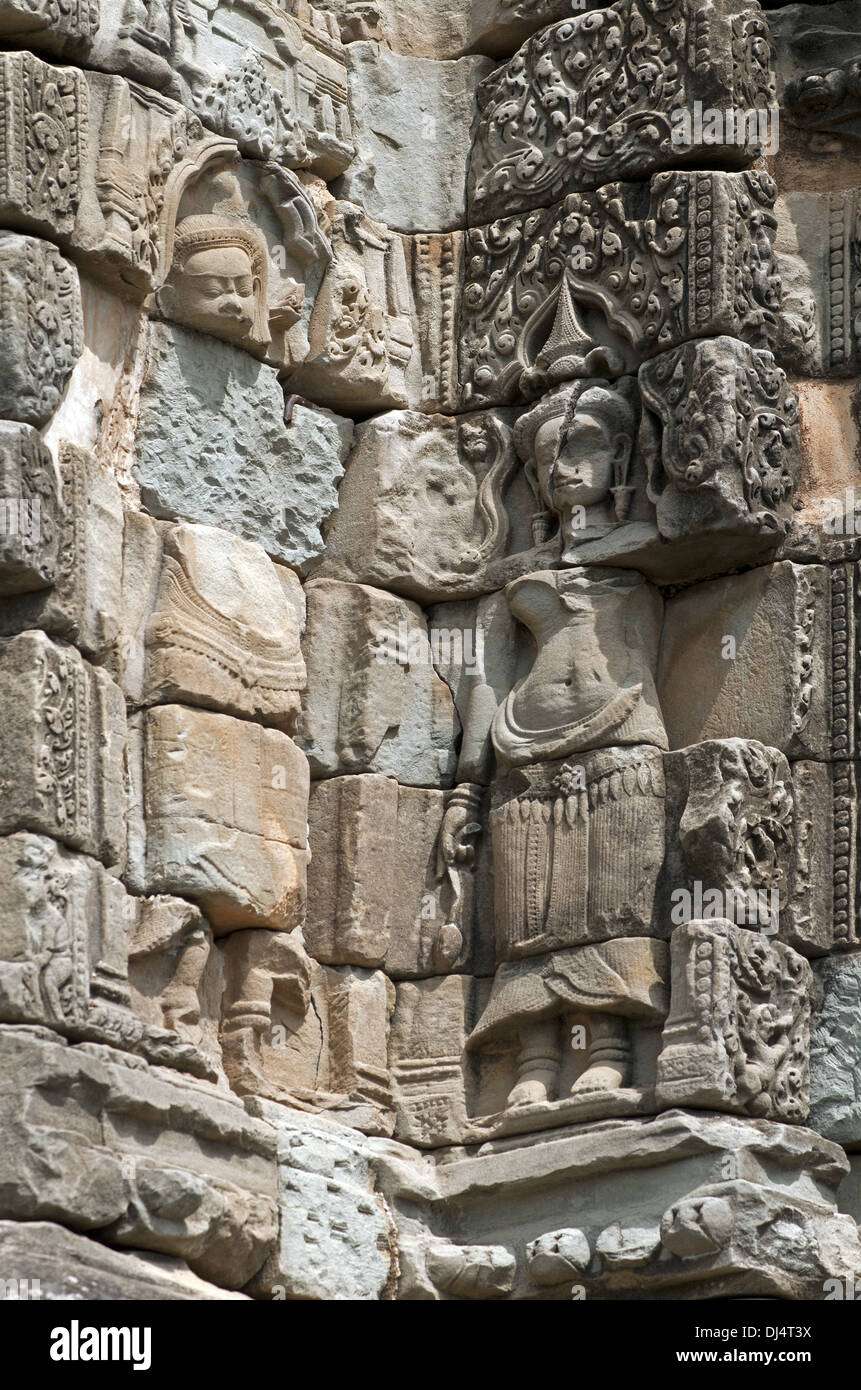 Devatas temple guardians, Bakong temple Stock Photo