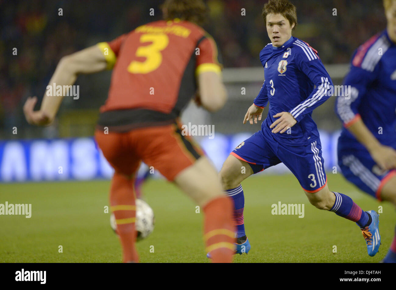 Brussels, Belgium. 19th Nov, 2013. (R-L) Gotoku Sakai (JPN), Daniel Van Buyten (BEL) Football / Soccer : International friendly match between Belgium 2-3 Japan at Stade Roi Baudouin in Brussels, Belgium . © FAR EAST PRESS/AFLO/Alamy Live News Stock Photo