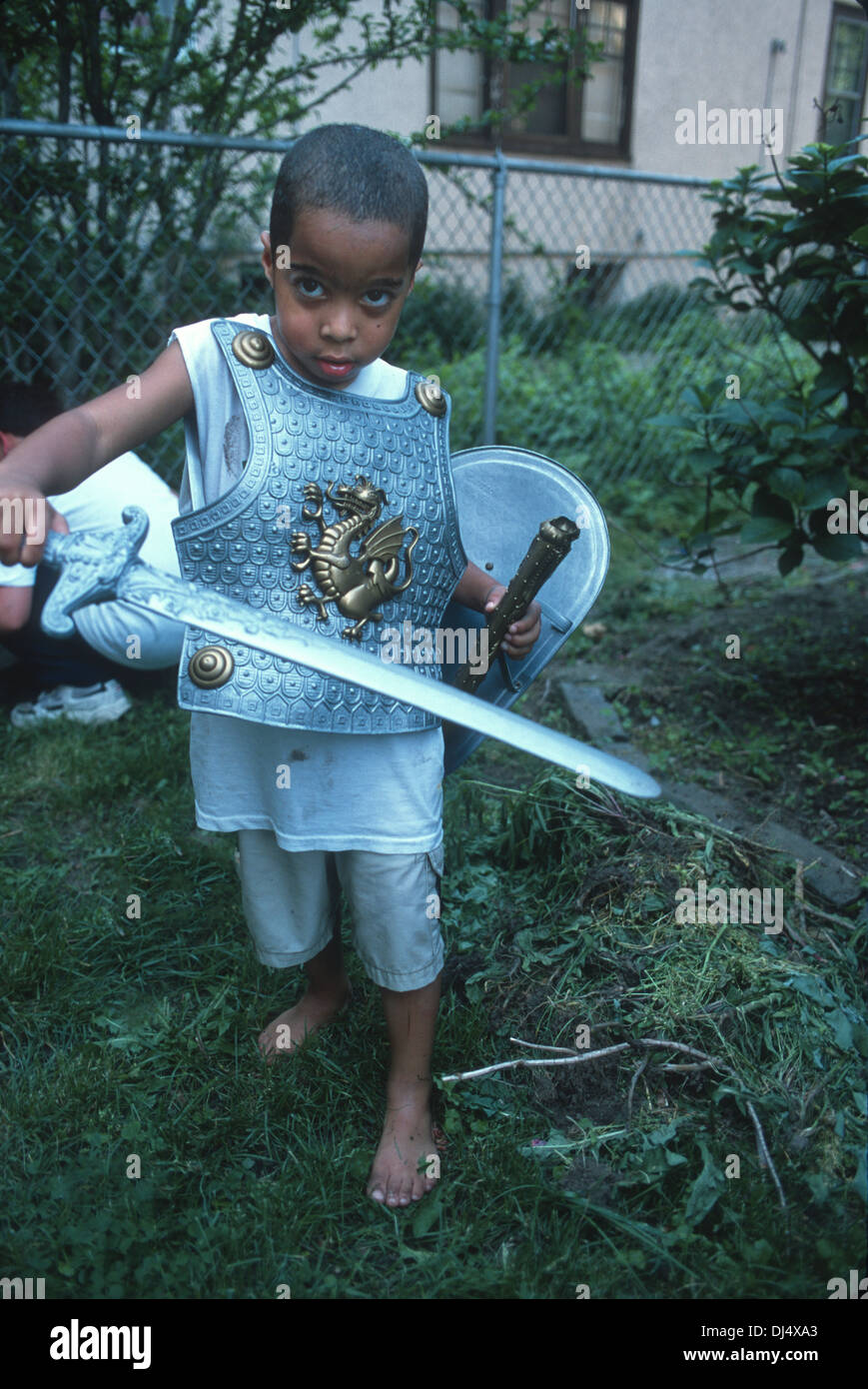 Young knight in his back yard ready for battle. Stock Photo