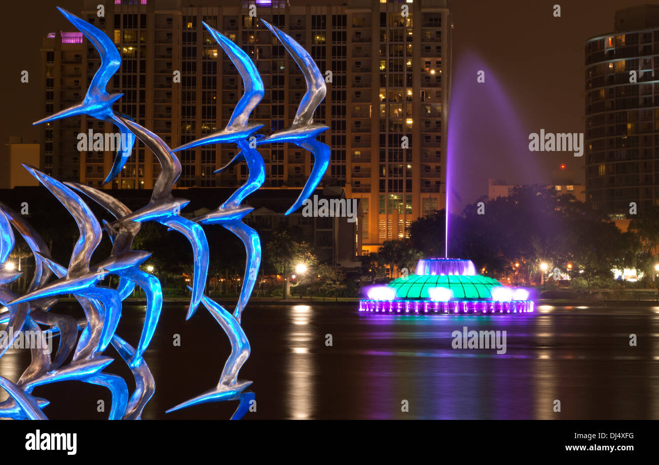 See Art Orlando sculpture 'Take Flight' by artist Douwe Blumberg on Lake Eola with downtown Orlando, Florida and fountain. Stock Photo