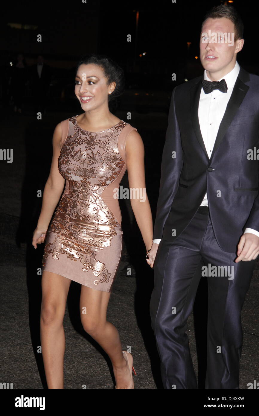 Old Trafford, Manchester, UK.  21 Nov 2013.  Phil Jones and Kaya Hall - Arrivals at the United for UNICEF Gala Dinner attended by the full Manchester United first-team and celebrities.  The dinner celebrated 14 years of the partnership between Manchester United and UNICEF, the worldÕs leading childrenÕs organisation, and raised over £200,000 for its work for vulnerable children around the world. Credit:  Deborah Vernon/Alamy Live News Stock Photo
