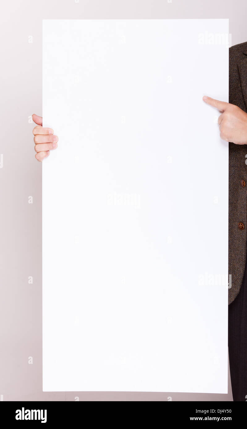 Advertising concept. Businessman holding blank sign empty billboard ...