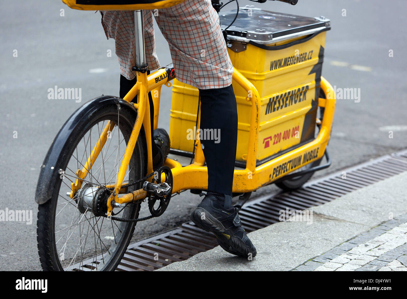 Biker, delivery bike messenger, delivery service in the city bike carrier, cargo bike Stock Photo
