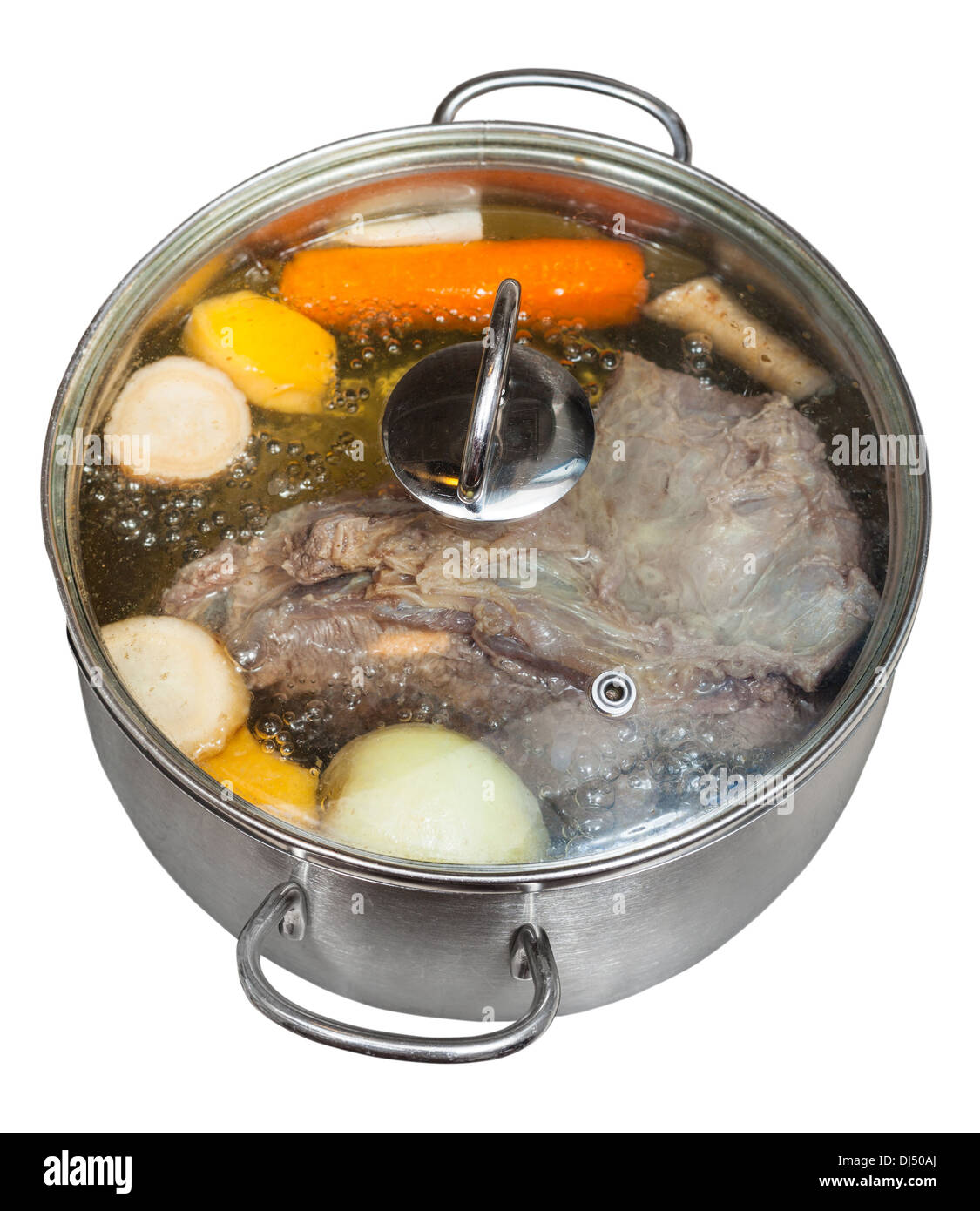 boiling of beef broth with seasoning vegetables in steel pan isolated on white background Stock Photo