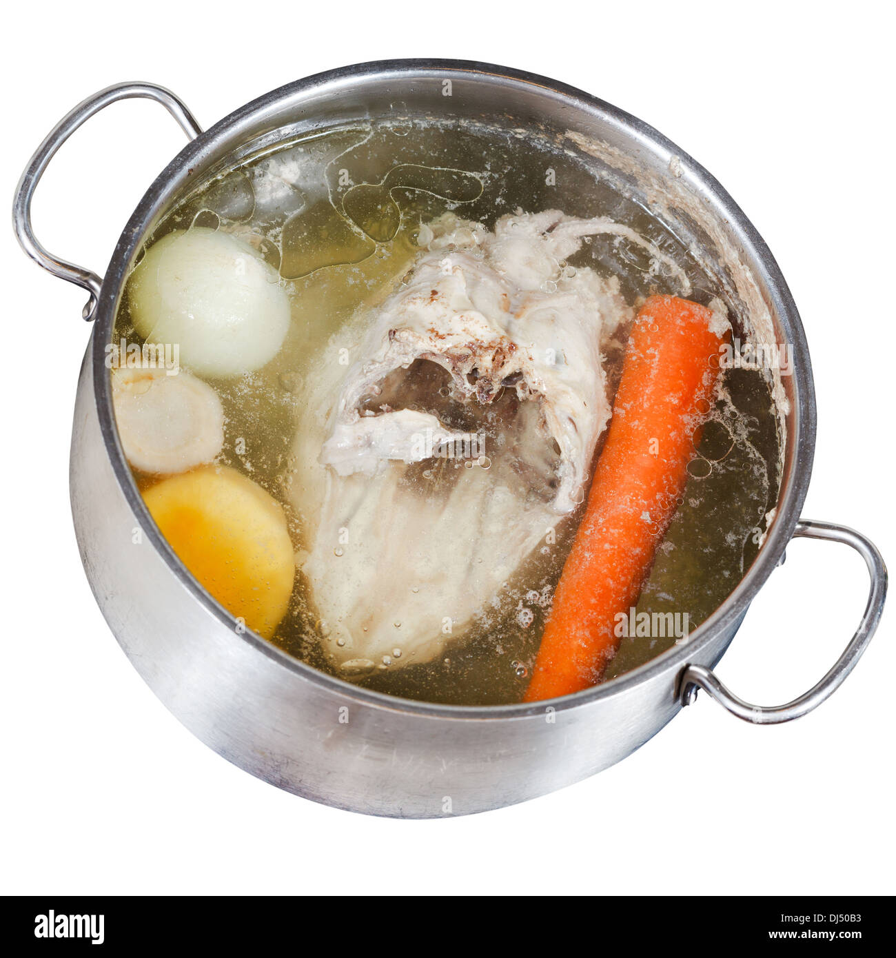 boiling of chicken soup with seasoning vegetables in steel pan isolated on white background Stock Photo