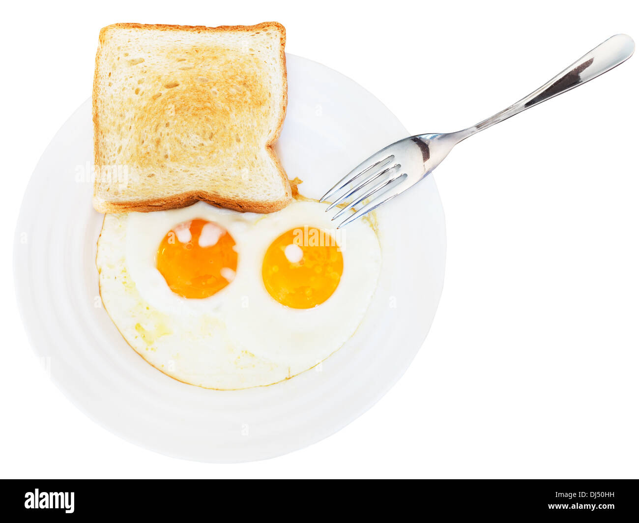 fresh toast and two fried eggs on white plate isolated on white background Stock Photo