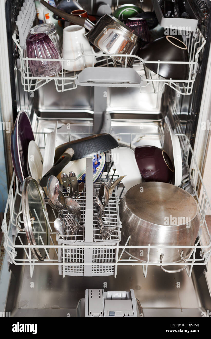 dirty cookware in open home dishwasher Stock Photo Alamy
