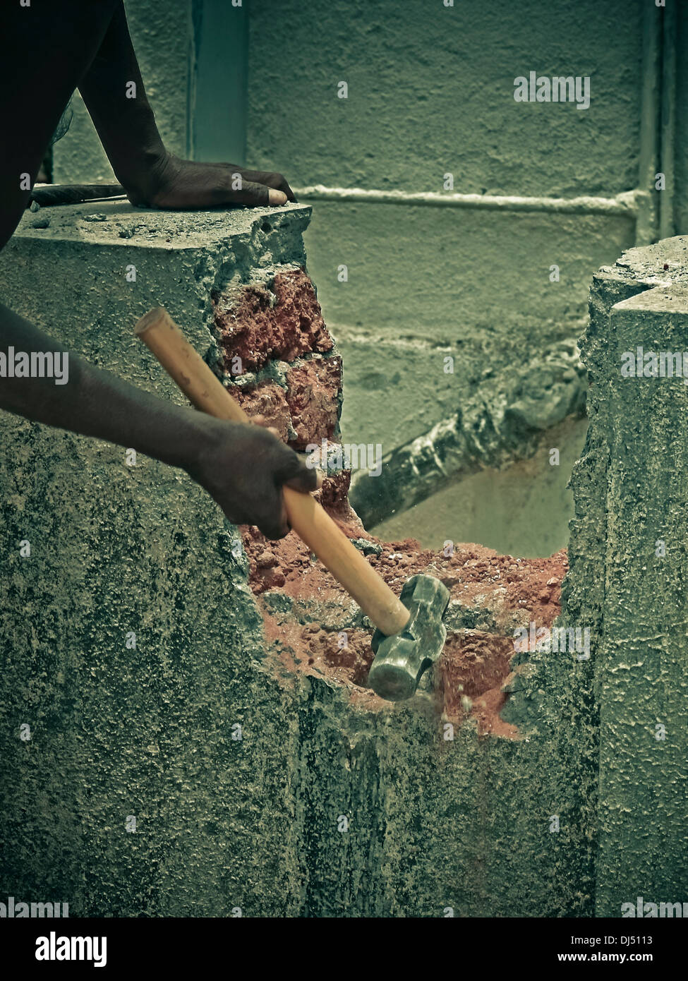 Worker with mallet and chisel, building construction Stock Photo Alamy