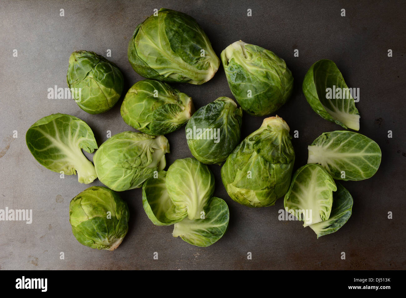 Fresh picked Brussels Sprouts arranged on a metal cooking sheet. Horizontal format. Stock Photo