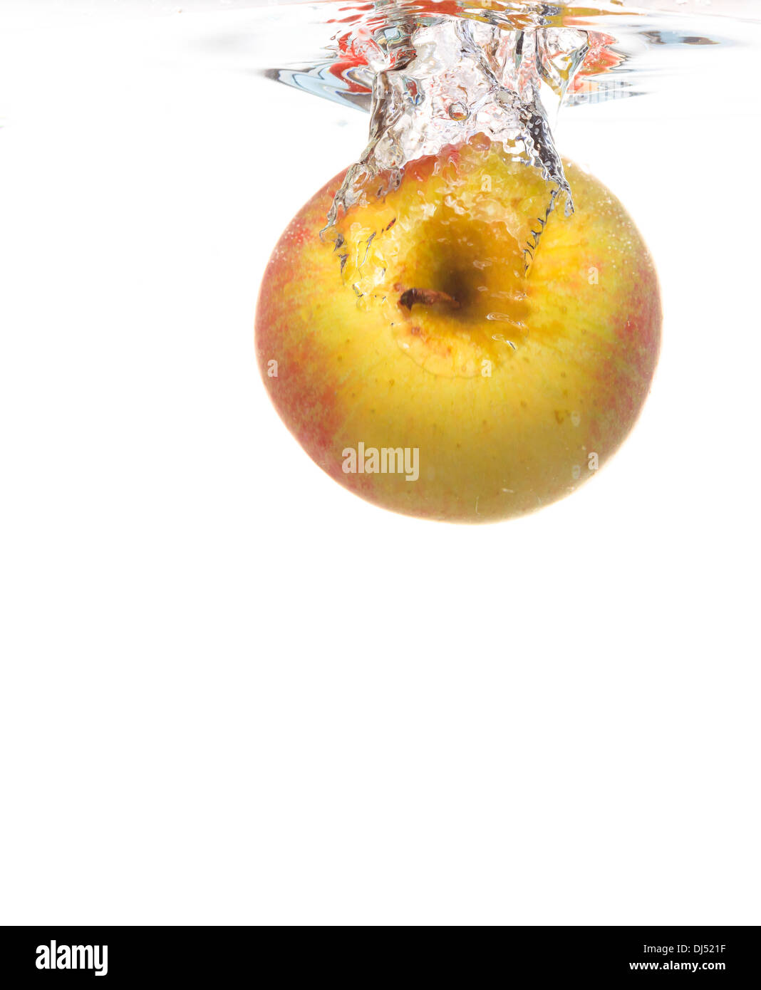 Red yellow apple in the water splash over white background. Healthy ...