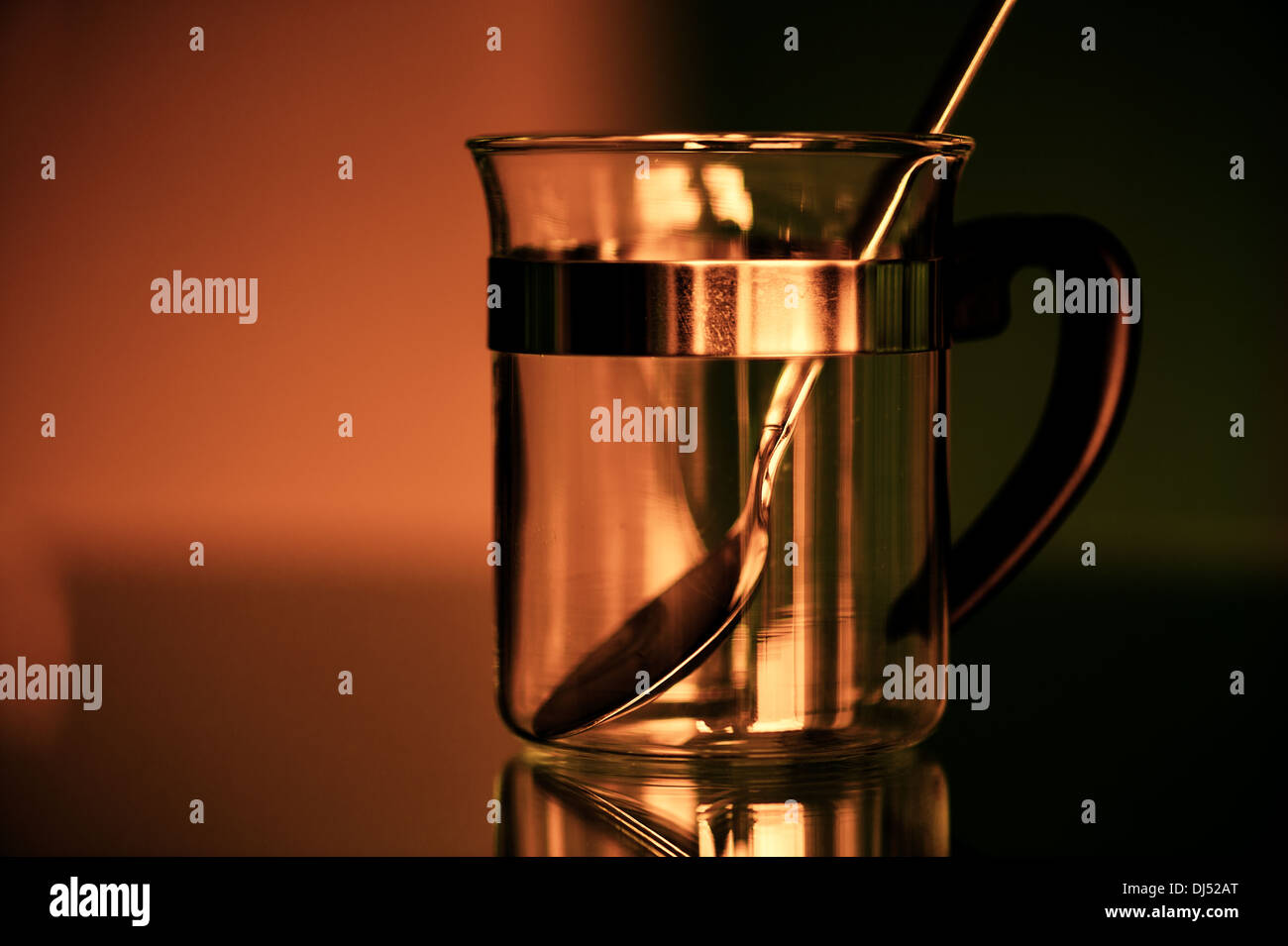 empty tea glass with a silver spoon Stock Photo