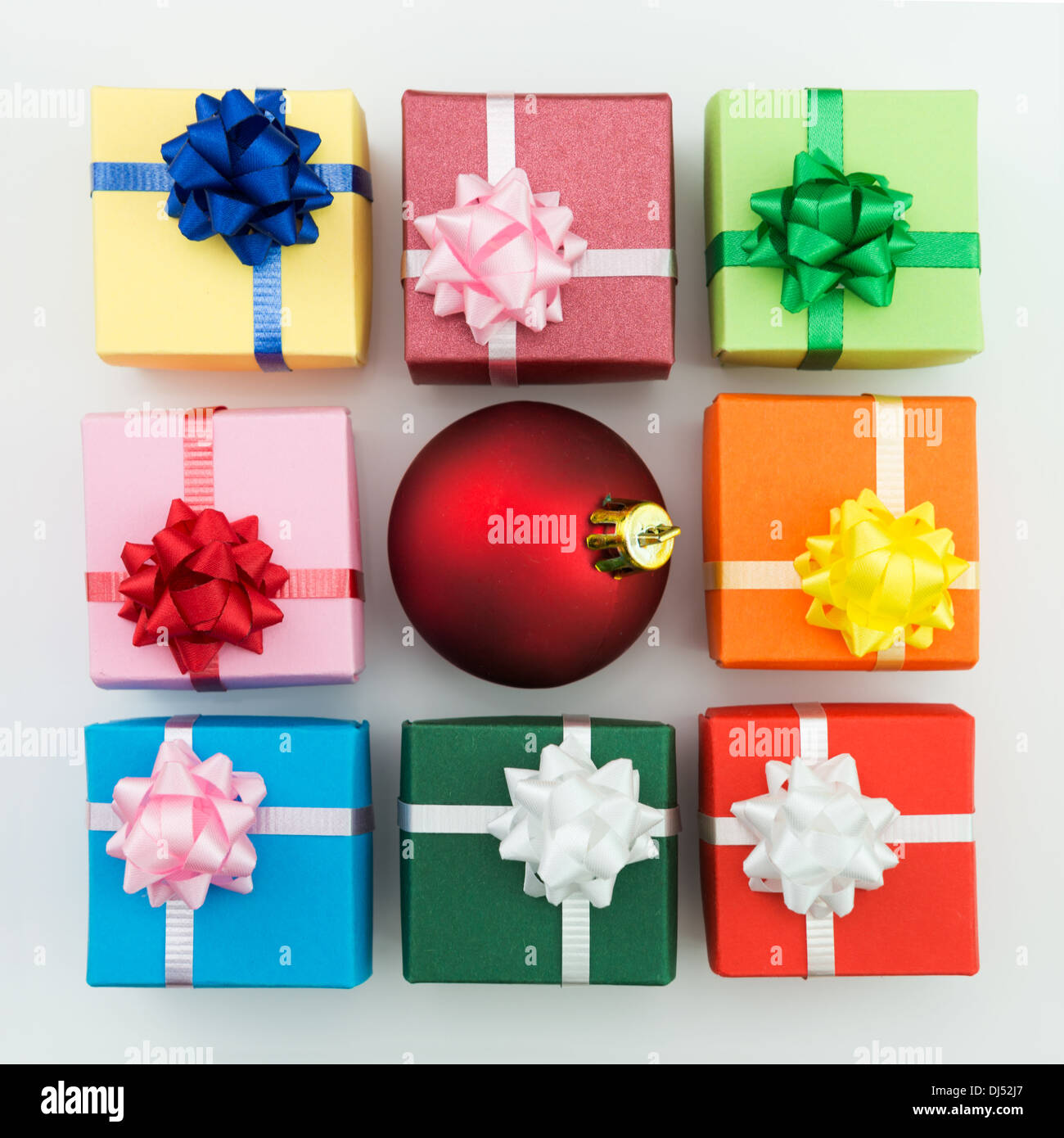 Multi color gift boxes and Christmas bauble Stock Photo