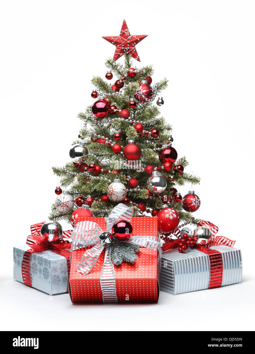 Decorated Christmas tree and gifts on white background Stock Photo