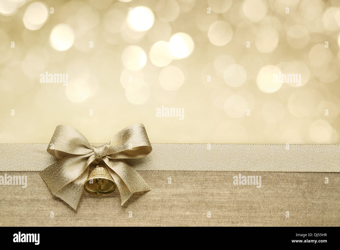 Golden ribbon bow with bokeh,Christmas decoration. Stock Photo